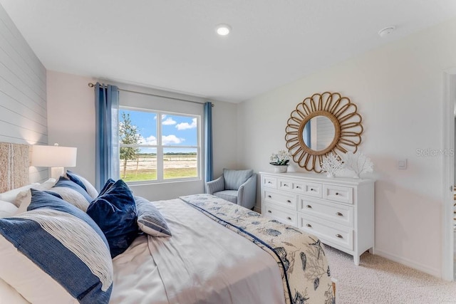 bedroom with light colored carpet