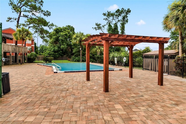 view of pool with a pergola and a patio