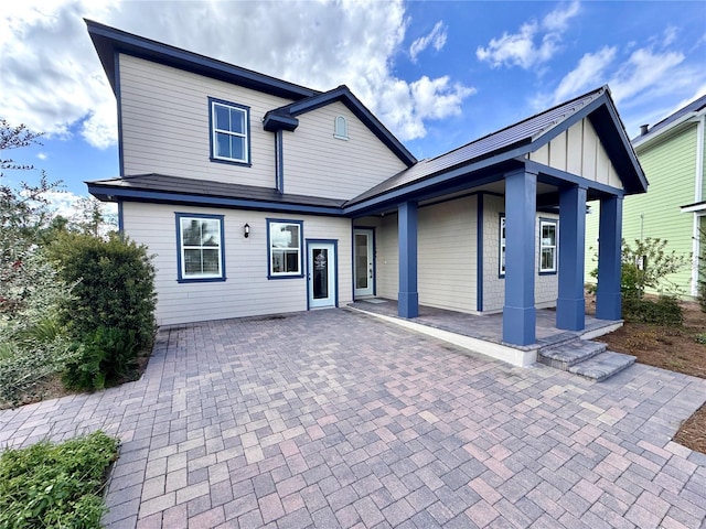 back of property featuring a patio area