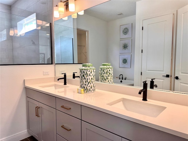 bathroom with vanity and independent shower and bath