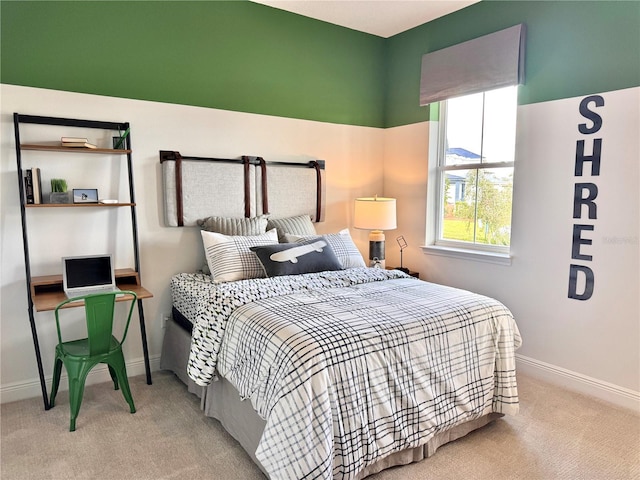 bedroom featuring light carpet