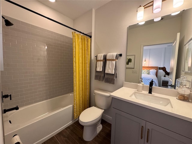 full bathroom with shower / bath combo with shower curtain, toilet, wood-type flooring, and vanity