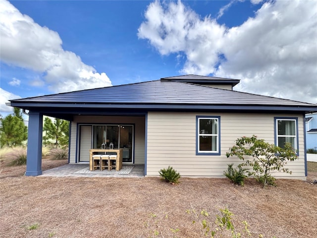 rear view of house featuring a patio