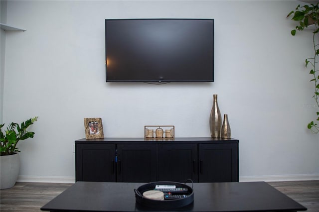 home office with dark hardwood / wood-style floors