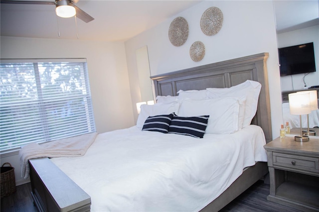 bedroom featuring ceiling fan and dark wood-type flooring