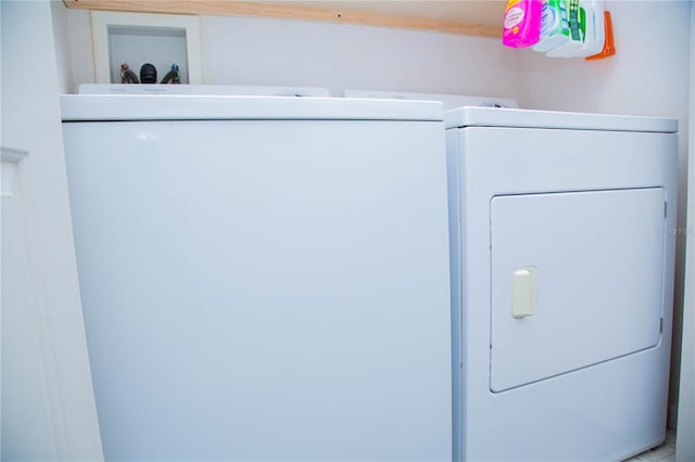 laundry area with independent washer and dryer