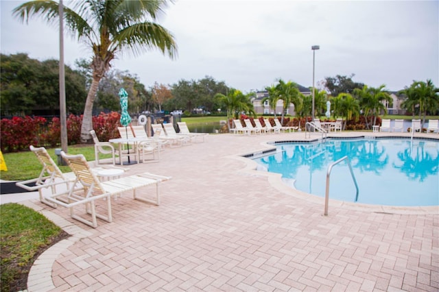 view of swimming pool with a patio