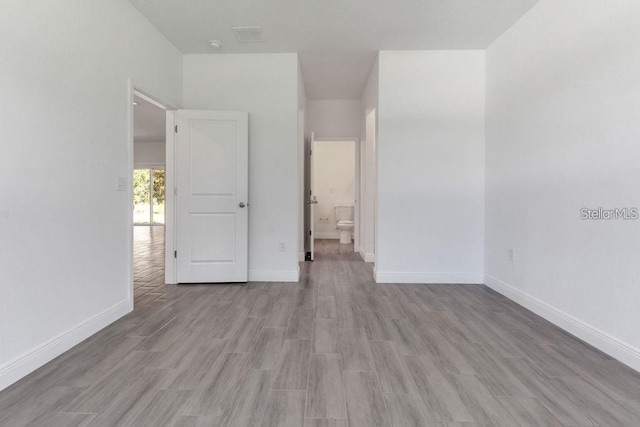 spare room with light hardwood / wood-style floors