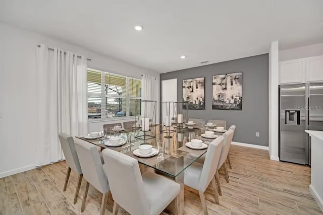 dining area featuring light wood-type flooring