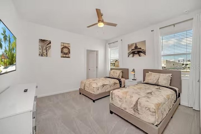 living area featuring ceiling fan and light carpet