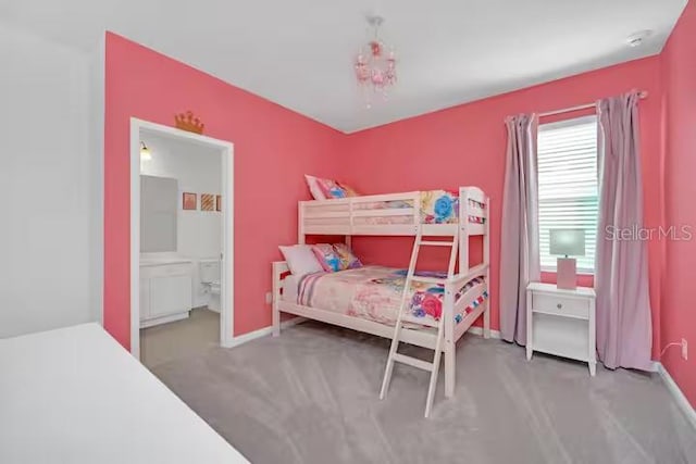 carpeted bedroom with ensuite bathroom