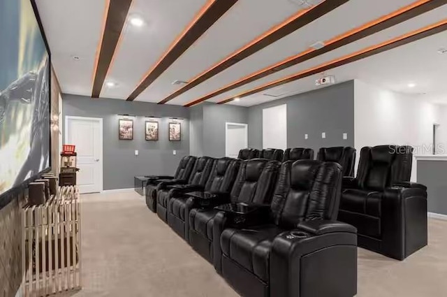 home theater room featuring beam ceiling