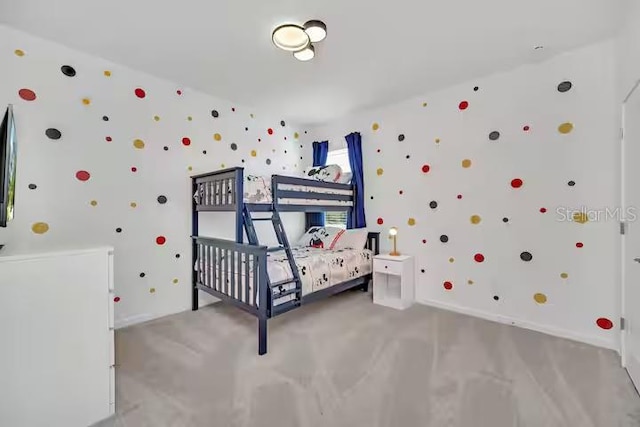 bedroom featuring light colored carpet