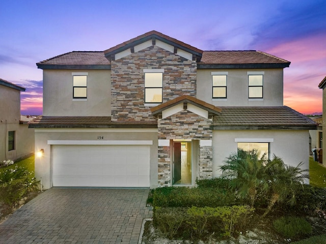 view of front of property featuring a garage