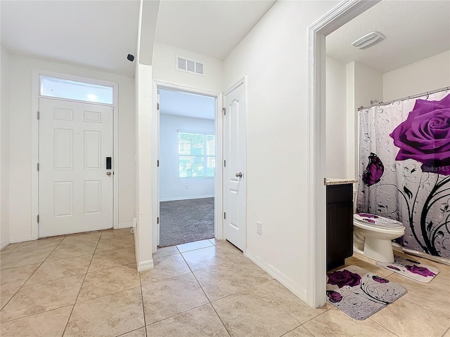 foyer with light tile patterned flooring