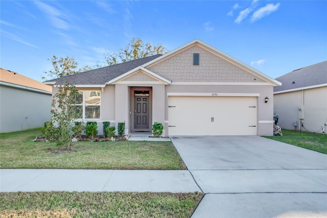 view of front of property featuring a garage and a front lawn