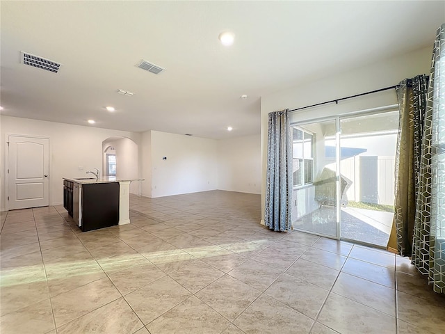 tiled empty room with sink