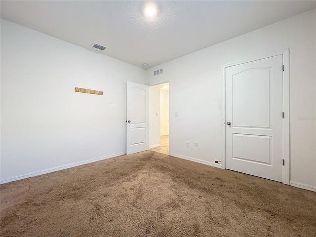 unfurnished bedroom featuring carpet floors