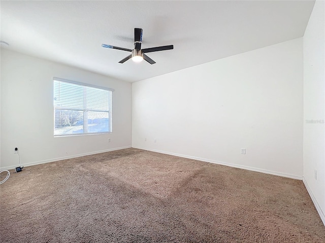 empty room with carpet and ceiling fan