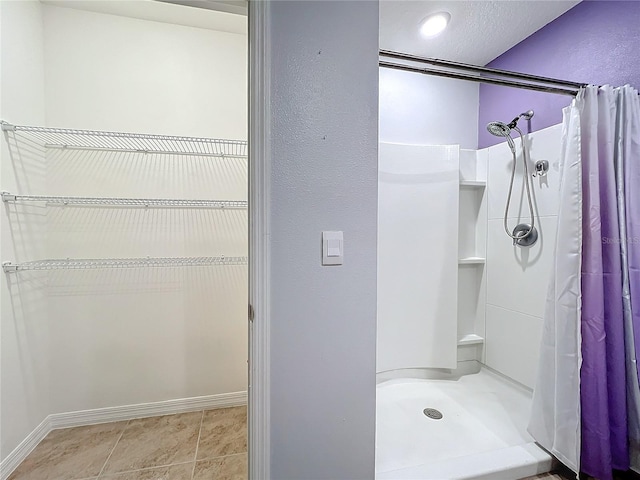 bathroom featuring a shower with curtain and tile patterned floors