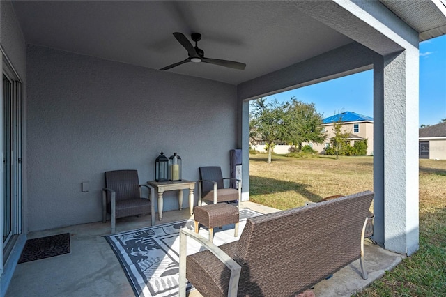 view of patio featuring ceiling fan