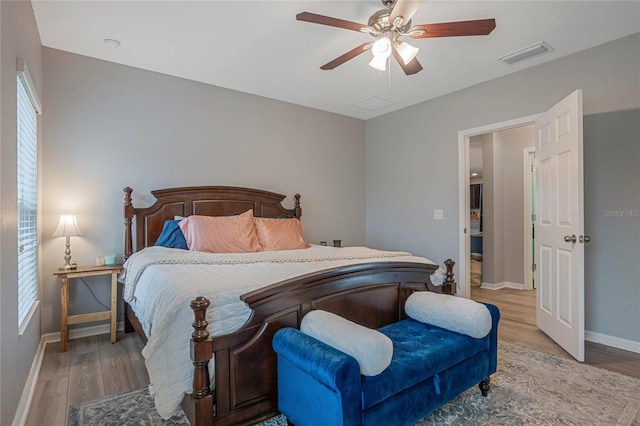 bedroom with light wood-type flooring and ceiling fan