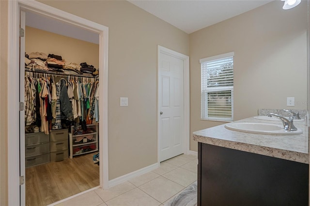 bathroom with vanity and tile patterned flooring