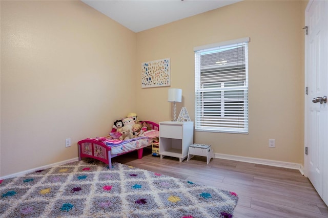 bedroom with light wood-type flooring