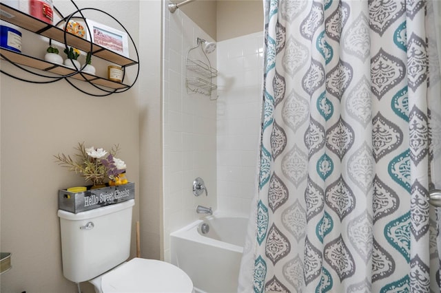 bathroom featuring toilet and shower / bath combo with shower curtain