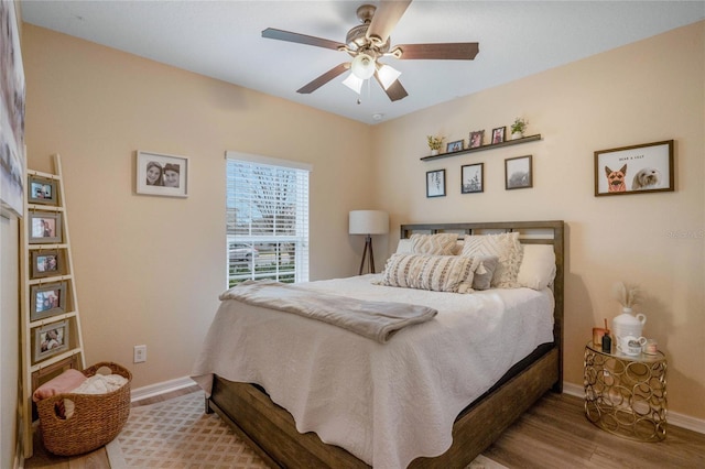 bedroom featuring ceiling fan and wood-type flooring