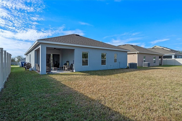 back of property featuring ceiling fan, a yard, a patio, and central air condition unit