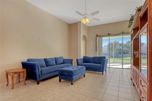 tiled living room with ceiling fan