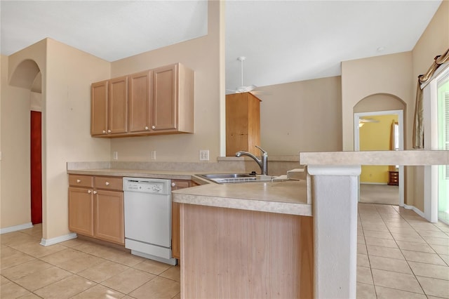 kitchen featuring light tile patterned flooring, sink, light brown cabinets, dishwasher, and kitchen peninsula