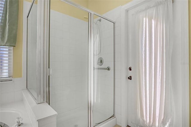 bathroom with plenty of natural light and an enclosed shower