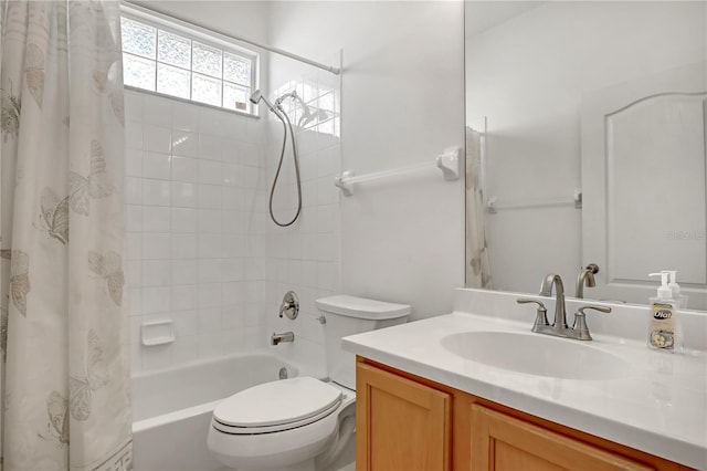 full bathroom with vanity, toilet, and shower / bath combo with shower curtain