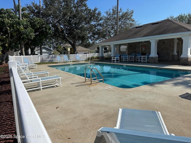 view of swimming pool with a patio