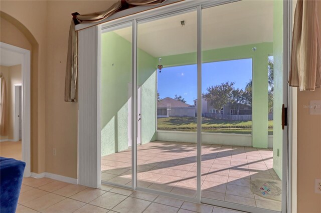 entryway featuring light tile patterned floors