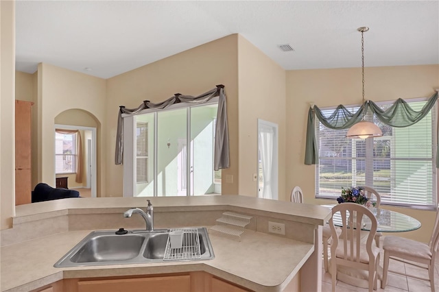 kitchen featuring decorative light fixtures and sink