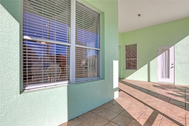 property entrance featuring a patio