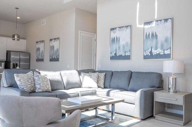 living room with a high ceiling