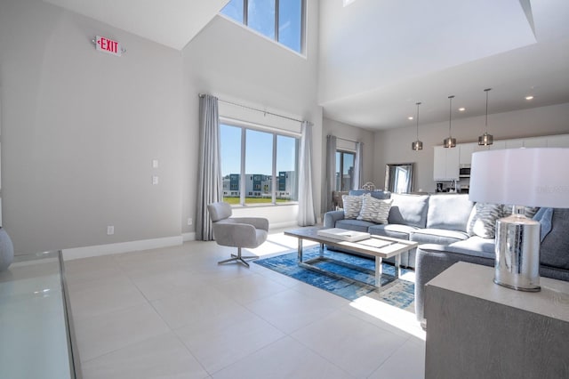 tiled living room with a high ceiling