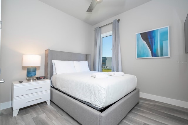 bedroom with light hardwood / wood-style floors and ceiling fan