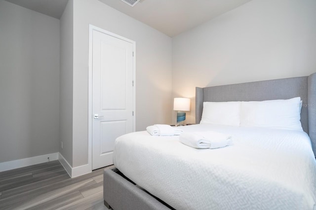 bedroom featuring hardwood / wood-style flooring