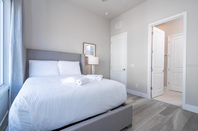 bedroom with light hardwood / wood-style floors