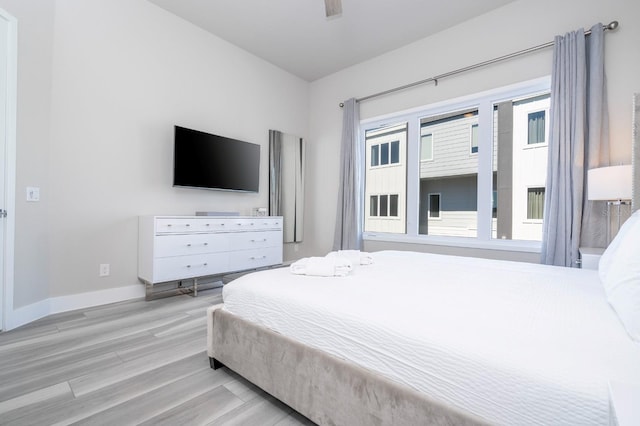 bedroom with light wood-type flooring