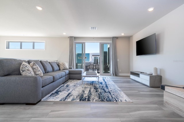 living room with light hardwood / wood-style floors