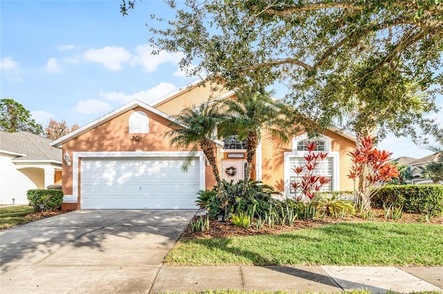 167 Castaway Beach Way, Kissimmee, FL 34746 - view of front facade with concrete driveway, an attached garage, and stucco siding