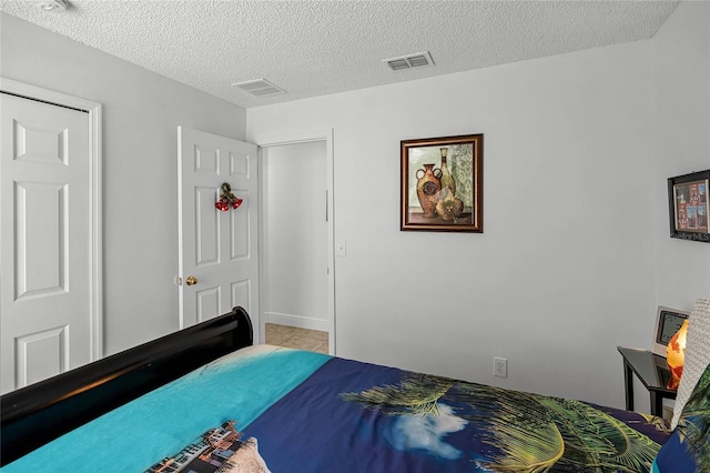 bedroom with a textured ceiling