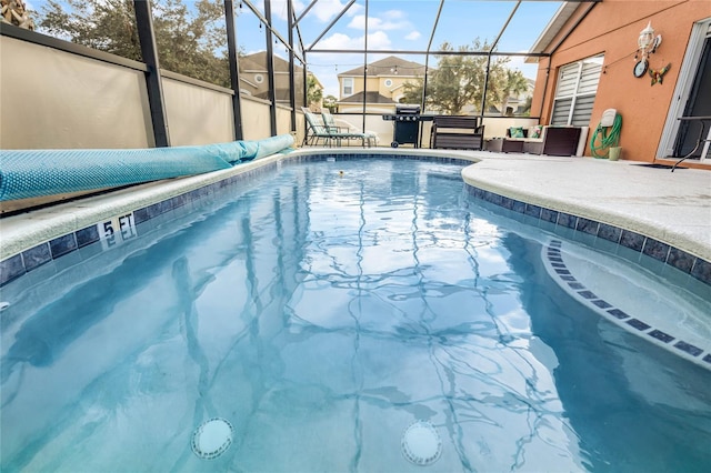 view of pool featuring a lanai and a patio