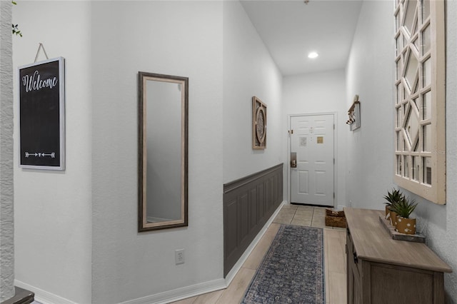 corridor with light tile patterned flooring